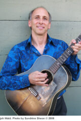 Elijah Wald photo, holding a guitar